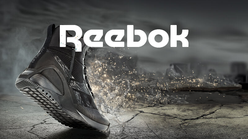 Black Reebok work boot with purple background, featuring a splash of color, highlighting comfort and durability