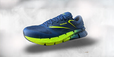 Blue safety toe athletic shoes with neon green accents, designed for comfort and protection.